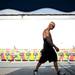 An employee walks the Jaycees' Summer Carnival grounds at Pioneer High School on Tuesday, June 25. Daniel Brenner I AnnArbor.com